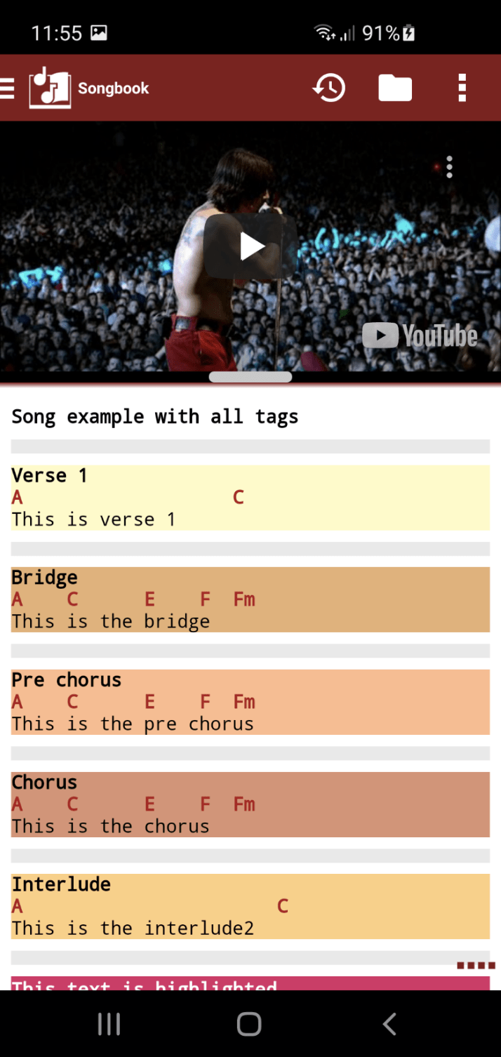 YouTube player embedded inside the Songbook playing a live concert above the song lyrics